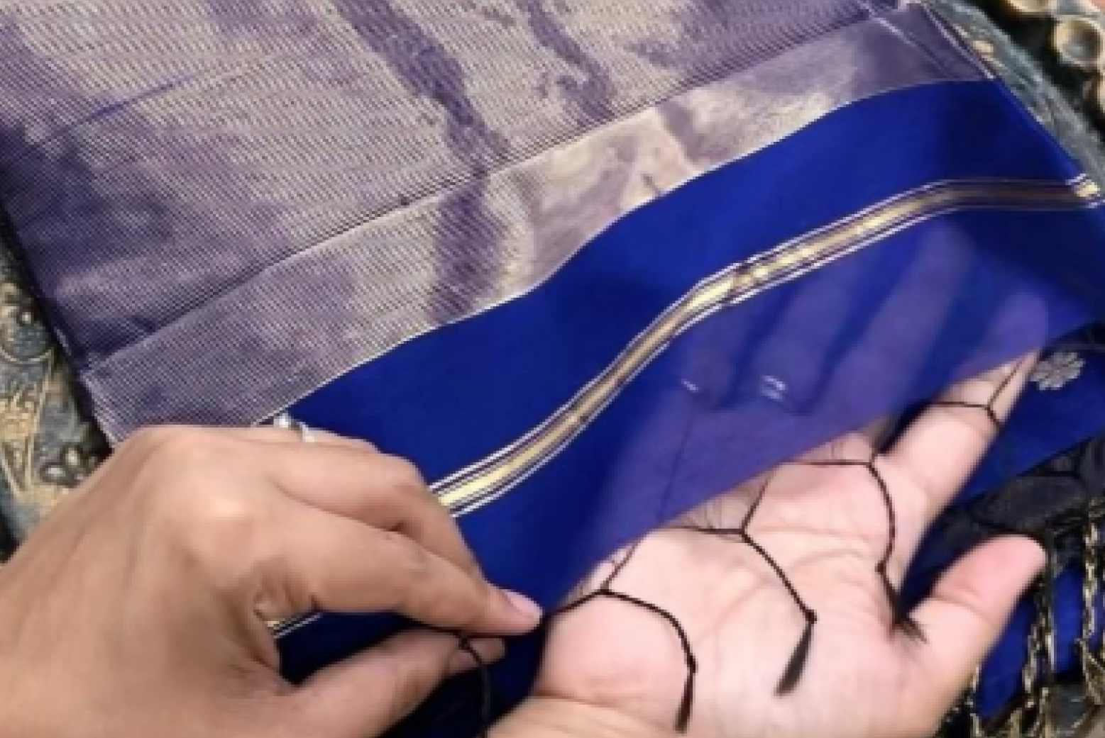 Blue saree edge with black tassels and metallic woven border