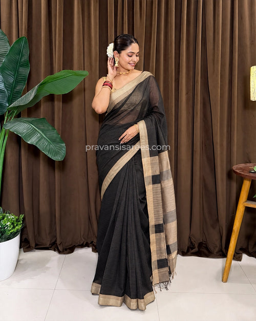 Model wearing the Maheshwari Classic Black Striped Saree with Pure Zari Lining