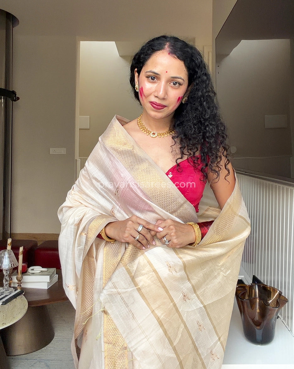 Styled model view of the Pure Maheshwari Barasingha White Butti Saree