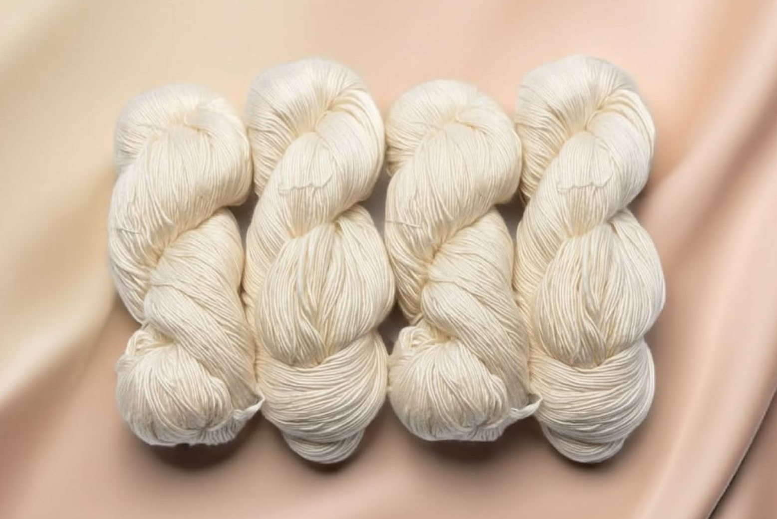 Natural white yarn skeins prepared for textile weaving