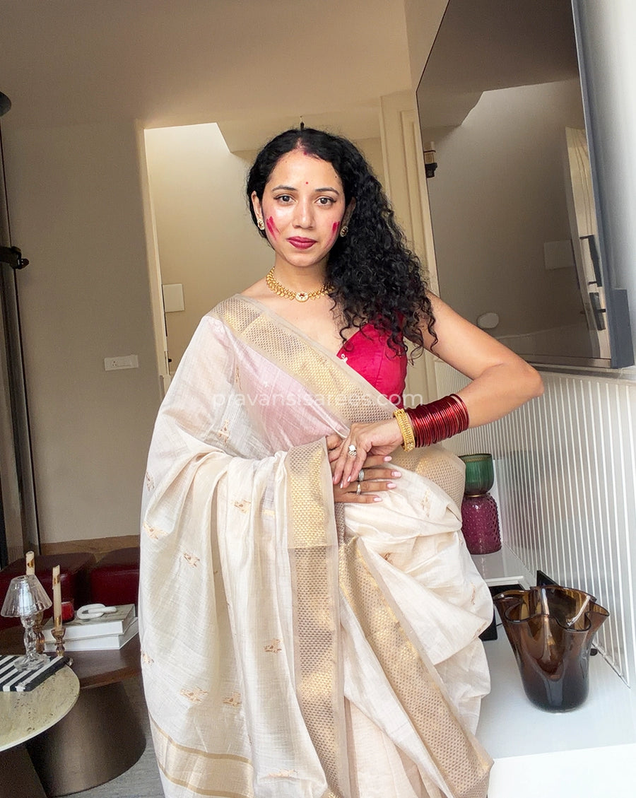 Model wearing the Pure Maheshwari Barasingha White Butti Saree
