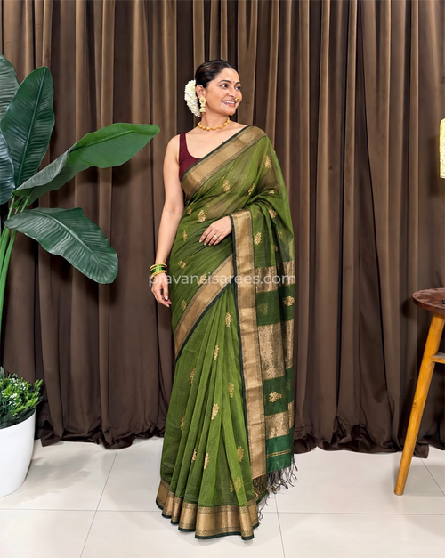 Model wearing the Pure Maheshwari Flower Butta Green Saree