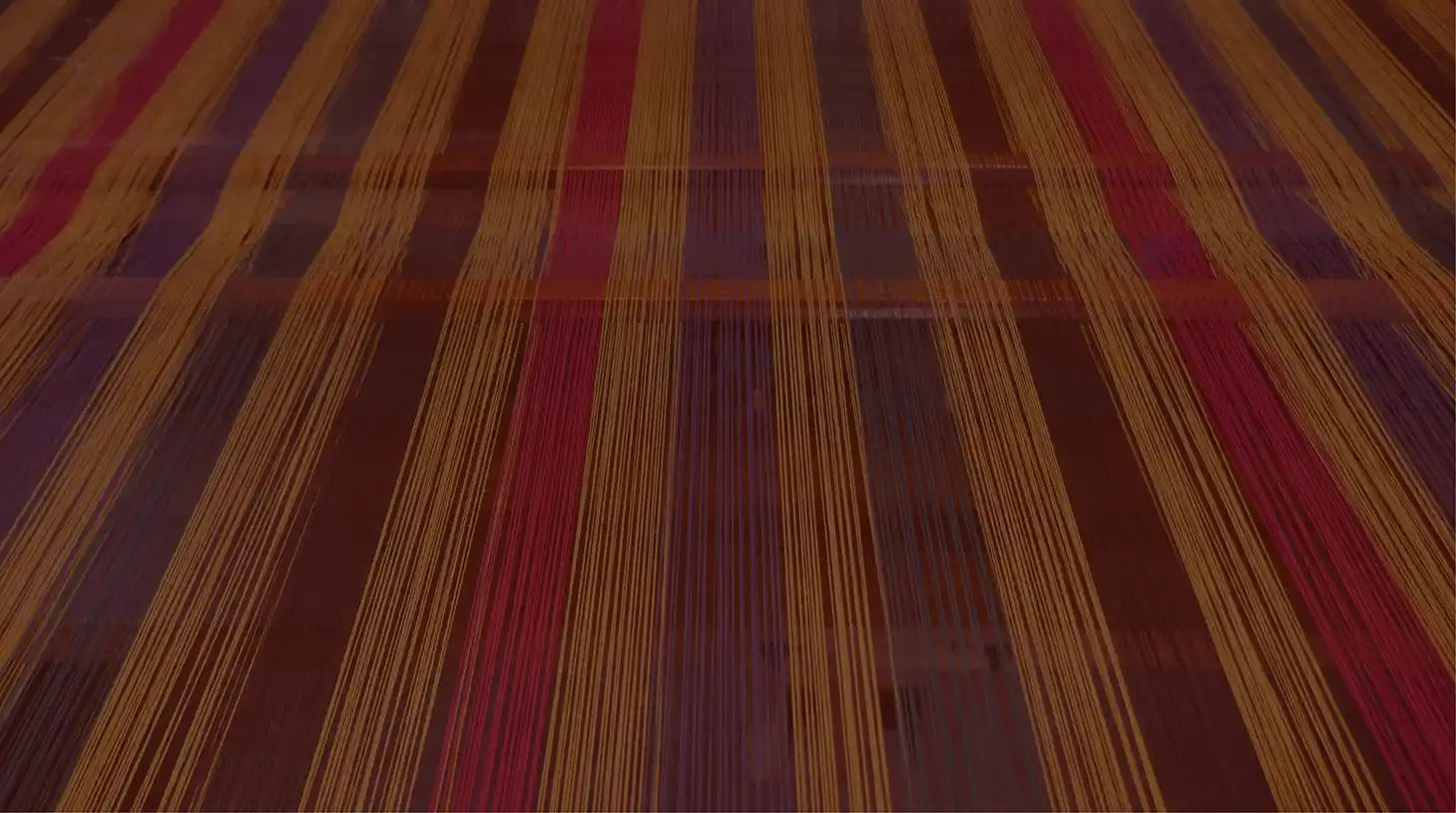 Colourful threads arranged on a traditional handloom for saree weaving